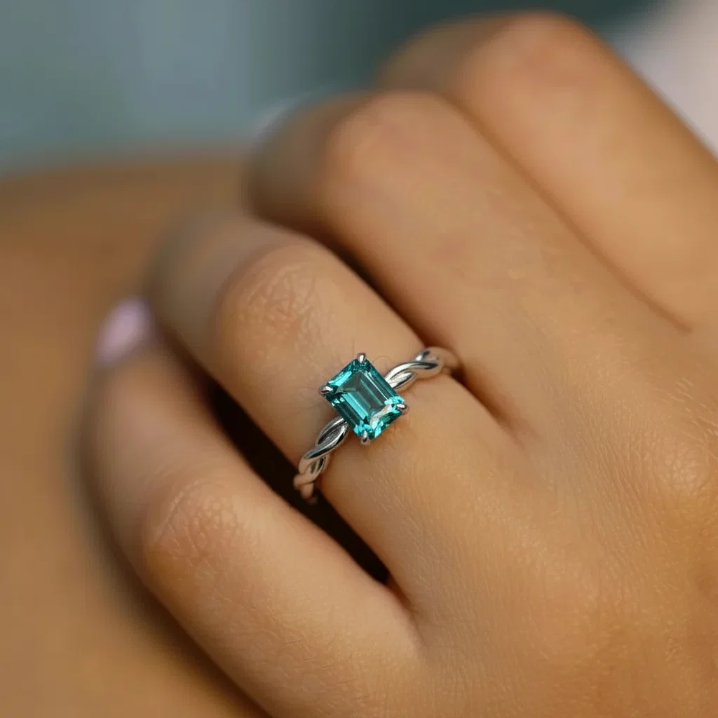 Bague de fiançailles tressée centre saphir teal taille radian